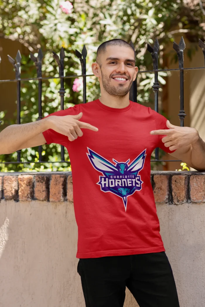 Whether you're cheering courtside or repping your team on the streets, this tee is a must-have for any true Charlotte Hornets enthusiast.