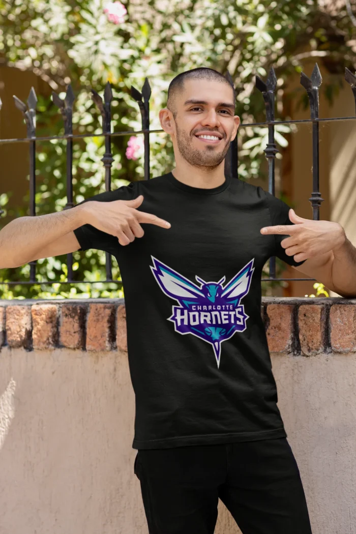 Whether you're cheering courtside or repping your team on the streets, this tee is a must-have for any true Charlotte Hornets enthusiast.