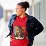 Unleash your inner rebel with our exclusive "Rebel Harmony" Tupac women's T-shirt. This edgy and stylish garment pays homage to the legendary Tupac Shakur, blending the rebellious spirit of his music with a touch of feminine flair. Crafted with passion, this shirt is a symbol of empowerment
