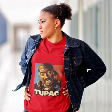 Unleash your inner rebel with our exclusive "Rebel Harmony" Tupac women's T-shirt. This edgy and stylish garment pays homage to the legendary Tupac Shakur, blending the rebellious spirit of his music with a touch of feminine flair. Crafted with passion, this shirt is a symbol of empowerment