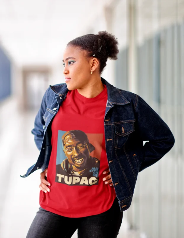 Unleash your inner rebel with our exclusive "Rebel Harmony" Tupac women's T-shirt. This edgy and stylish garment pays homage to the legendary Tupac Shakur, blending the rebellious spirit of his music with a touch of feminine flair. Crafted with passion, this shirt is a symbol of empowerment