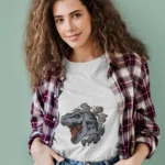 Embrace the allure of the prehistoric era with a twist of modern fashion, making a statement that is both powerful and chic. Elevate your wardrobe with this one-of-a-kind tee that captures the essence of fearlessness and grace.