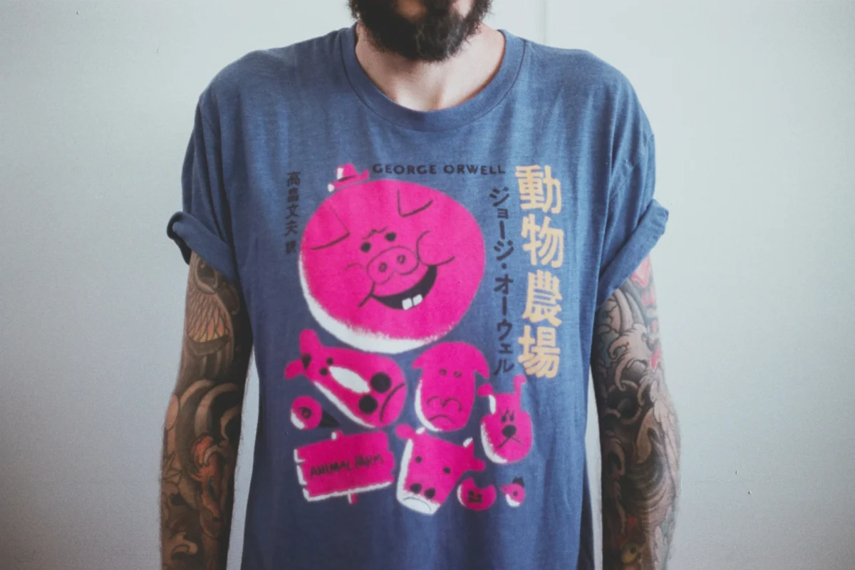 Cool graphic t-shirts in various designs and styles displayed on a rack.