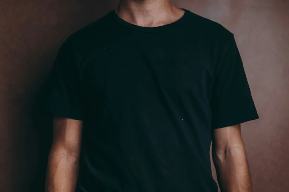 The Rock wearing a fitted black shirt, exemplifying a stylish and confident look.
