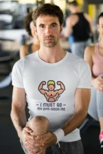 "I Must Go GYM" t-shirt for men in breathable cotton, perfect for workouts and casual wear.