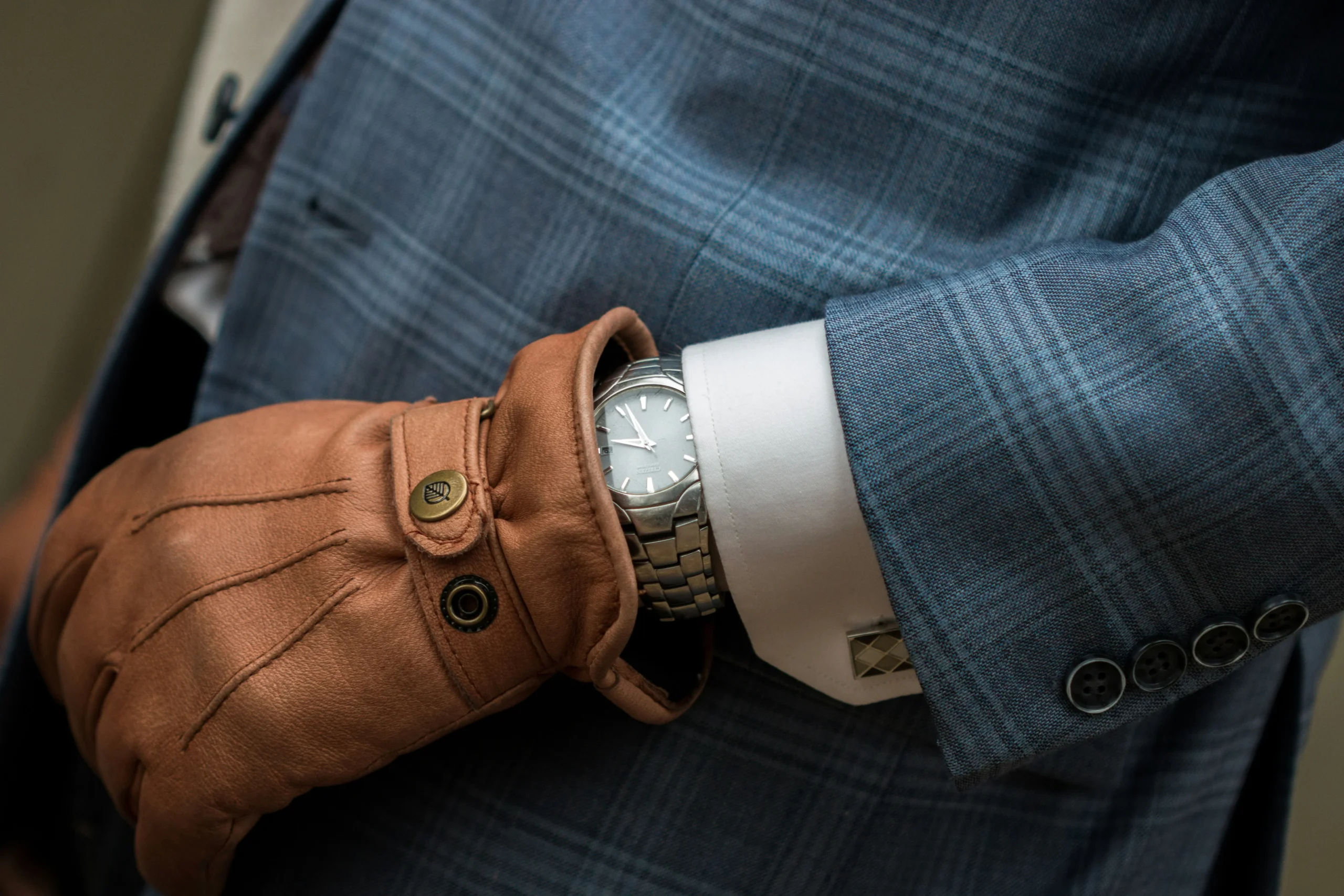 A stylish man wearing a well-fitted jacket shirt paired with jeans, perfect for a casual day out.