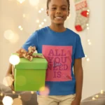 Boys wearing a "All You Need is Love" t-shirt, featuring colorful text on a soft cotton fabric.