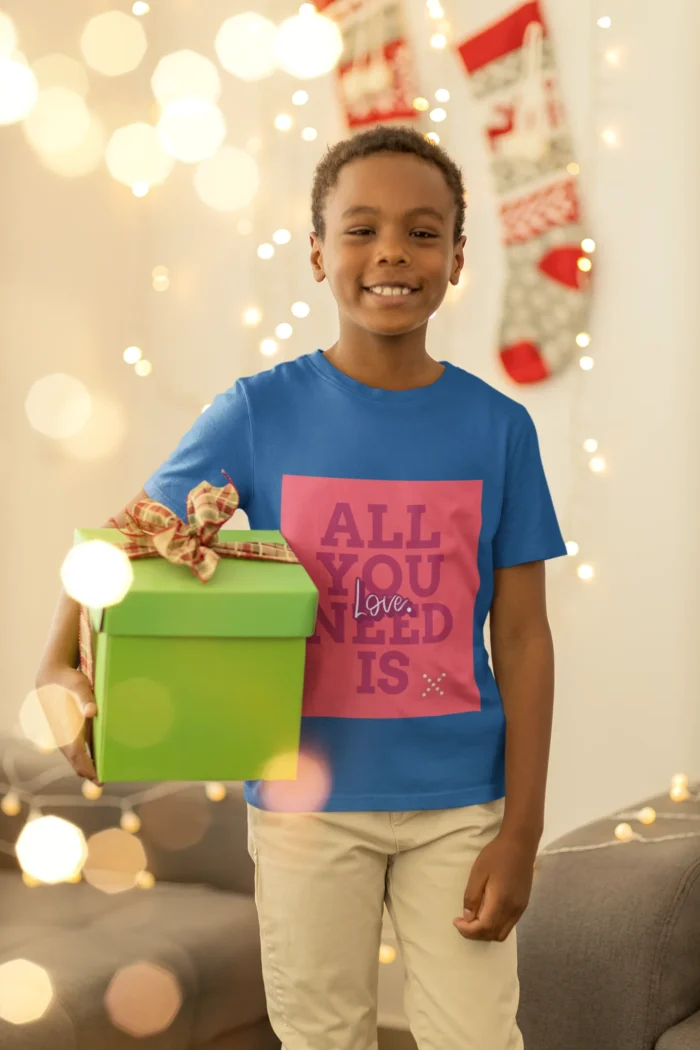 Boys wearing a "All You Need is Love" t-shirt, featuring colorful text on a soft cotton fabric.