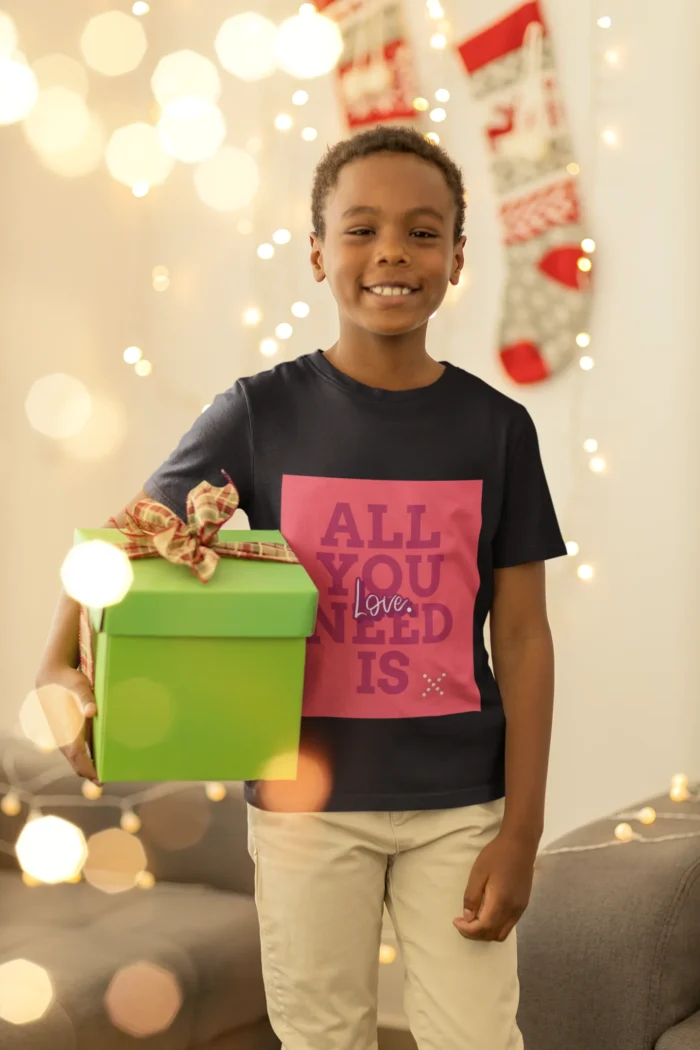 Boys wearing a "All You Need is Love" t-shirt, featuring colorful text on a soft cotton fabric.