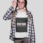 Stylish girl wearing a New York streetwear t-shirt, featuring bold urban designs