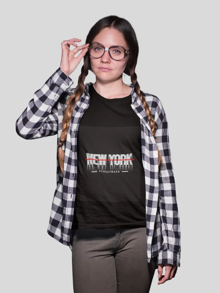 Stylish girl wearing a New York streetwear t-shirt, featuring bold urban designs