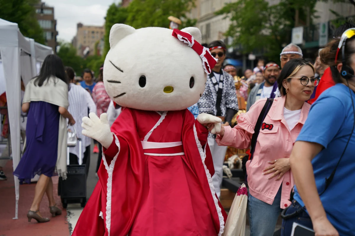 A cozy Hello Kitty hoodie with a cute bow and whiskers, perfect for casual wear