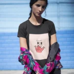 Woman wearing a "Nobody Cares Go Away" t-shirt in a relaxed, casual setting.