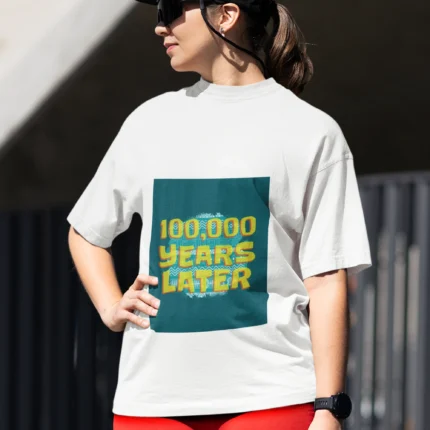 100,000 Years Later meme t-shirt for women featuring a humorous graphic in a comfortable, casual fit.