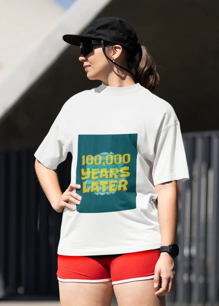 100,000 Years Later meme t-shirt for women featuring a humorous graphic in a comfortable, casual fit.