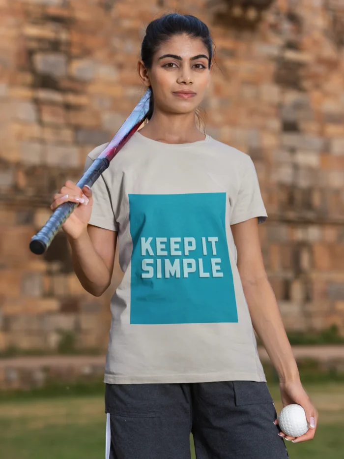 Women's "Keep It Simple" t-shirt in white, showcasing a minimalist design with elegant lettering.