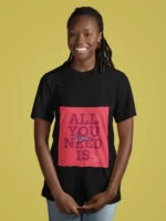 Women wearing "All You Need Is Love" t-shirt, featuring a minimalist heart design on soft cotton fabric.