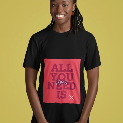 Women wearing "All You Need Is Love" t-shirt, featuring a minimalist heart design on soft cotton fabric.