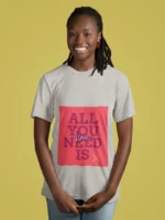 Women wearing "All You Need Is Love" t-shirt, featuring a minimalist heart design on soft cotton fabric.