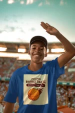 Boy wearing a blue practice basketball t-shirt, dribbling a basketball on an outdoor court.