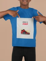 A boys' t-shirt with the bold graphic "Born to Jump" printed on the front, showcasing vibrant colors and a dynamic design.