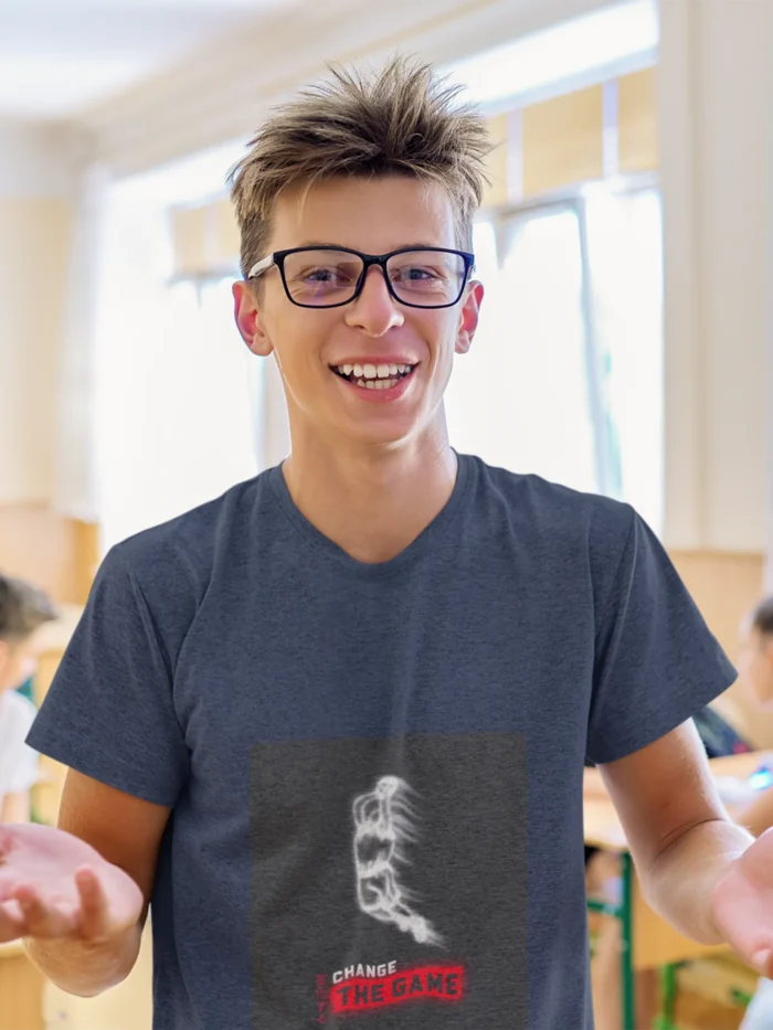 Boy wearing "Change the Game" basketball t-shirt, showcasing bold graphic design and athletic fit.