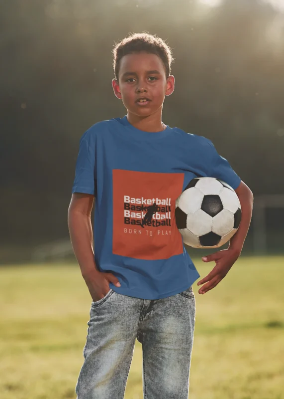 Boy wearing Born to Play Basketball t-shirt featuring bold basketball-themed design.