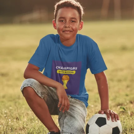 Boys wearing Champions Stay Winning t-shirt in action