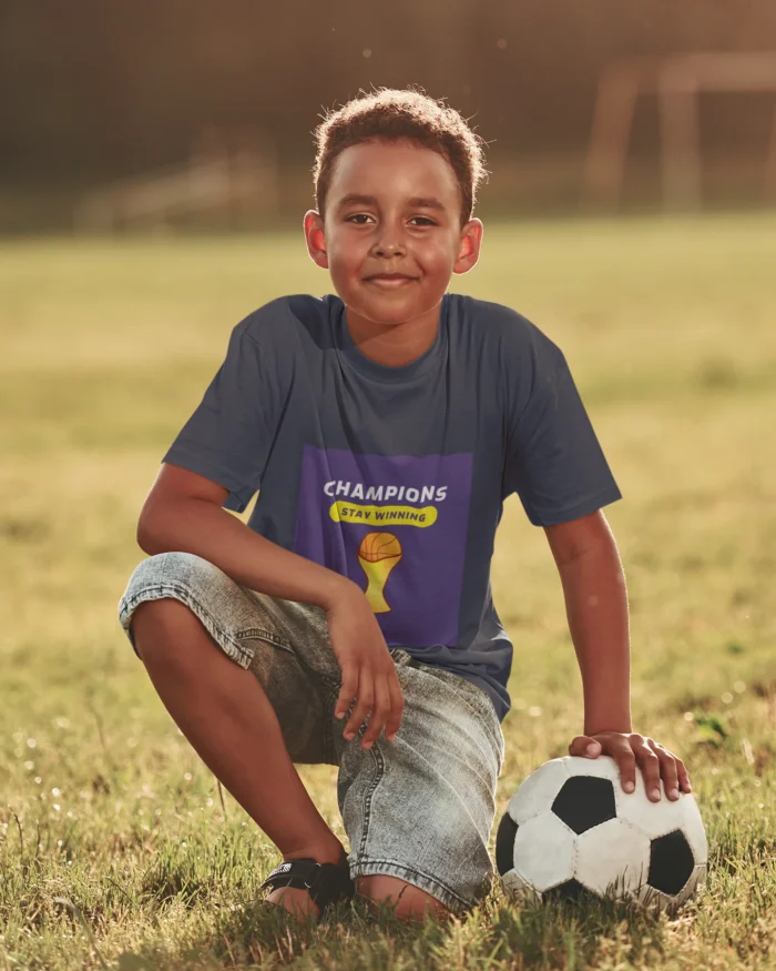 Boys wearing Champions Stay Winning t-shirt in action