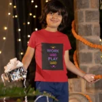 Boys wearing "Work Hard Play Hard" t-shirt, enjoying both work and play.