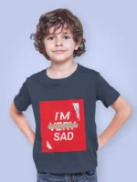 Boy wearing an "I'm Sad" graphic t-shirt with bold text design, expressing an emotional yet trendy statement.