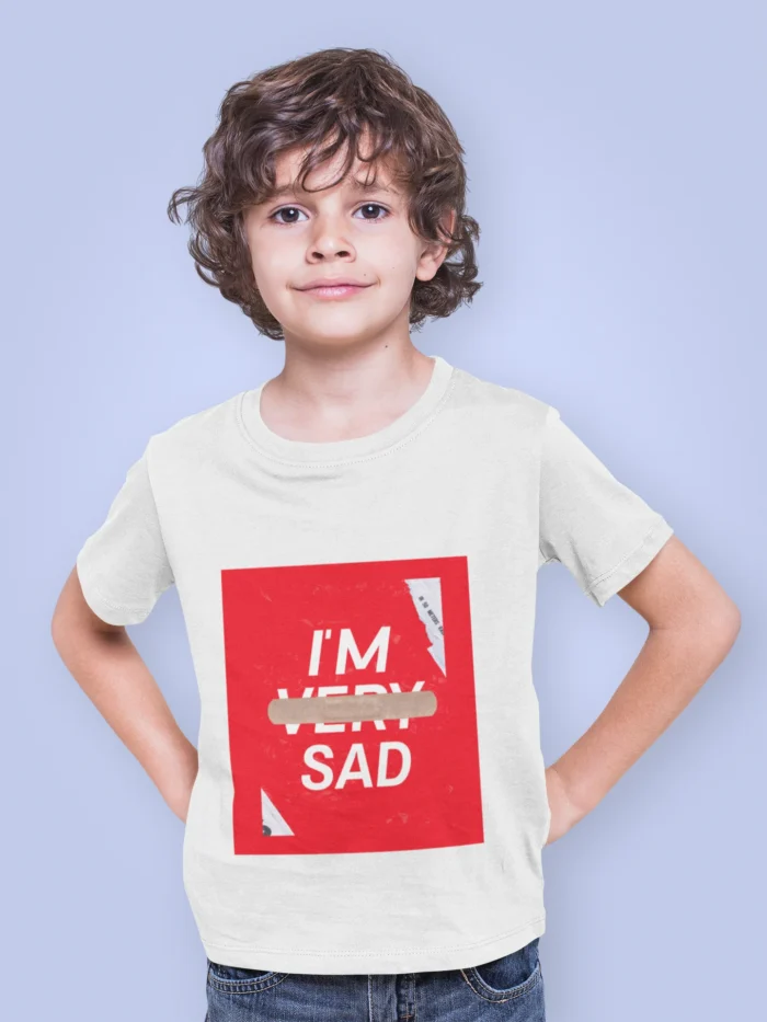 Boy wearing an "I'm Sad" graphic t-shirt with bold text design, expressing an emotional yet trendy statement.