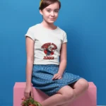 A girls' "Horror Movie Junkie" t-shirt featuring a spooky, playful design with bold lettering and horror-themed graphics.